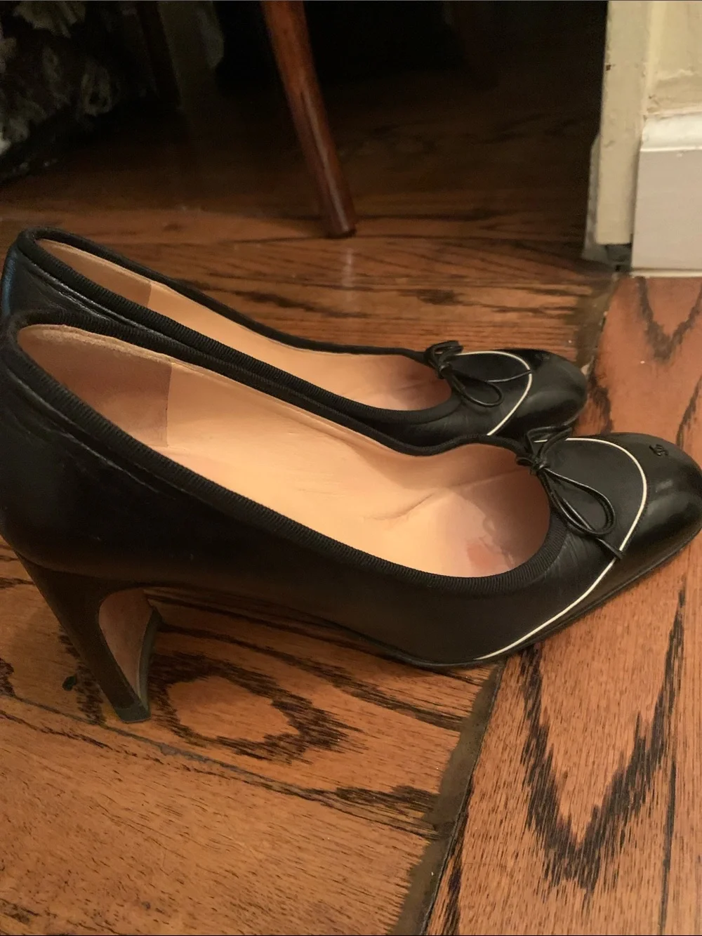 CHANEL Black Leather Ballet Flats with Bow and Gold Trim